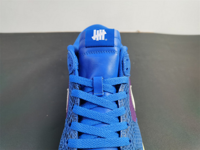 undefeated’s “dunk vs. af-1” collection grows with this snakeskin-dressed   dh6508-400